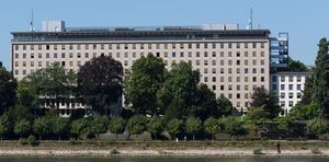Landscape photograph of the 1955 German Foreign Office building, with trees in the foreground