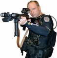 Anders Behring Breivik in diving suit with gun (self portrait).jpg